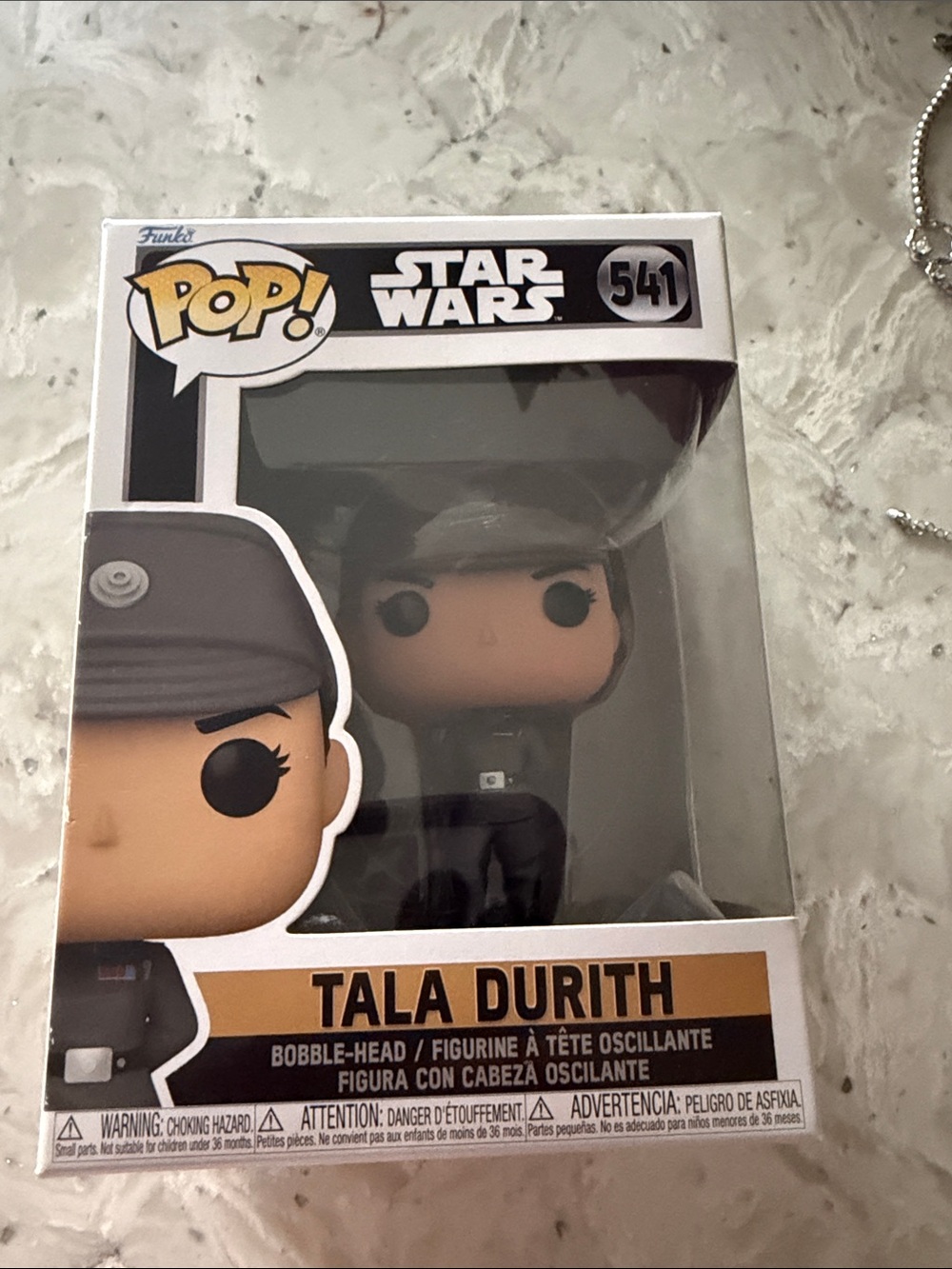 Funko Pop! Figure with Black Hat and Tan Face